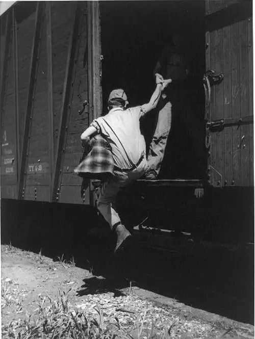 Helping a fellow rider aboard, 1939
