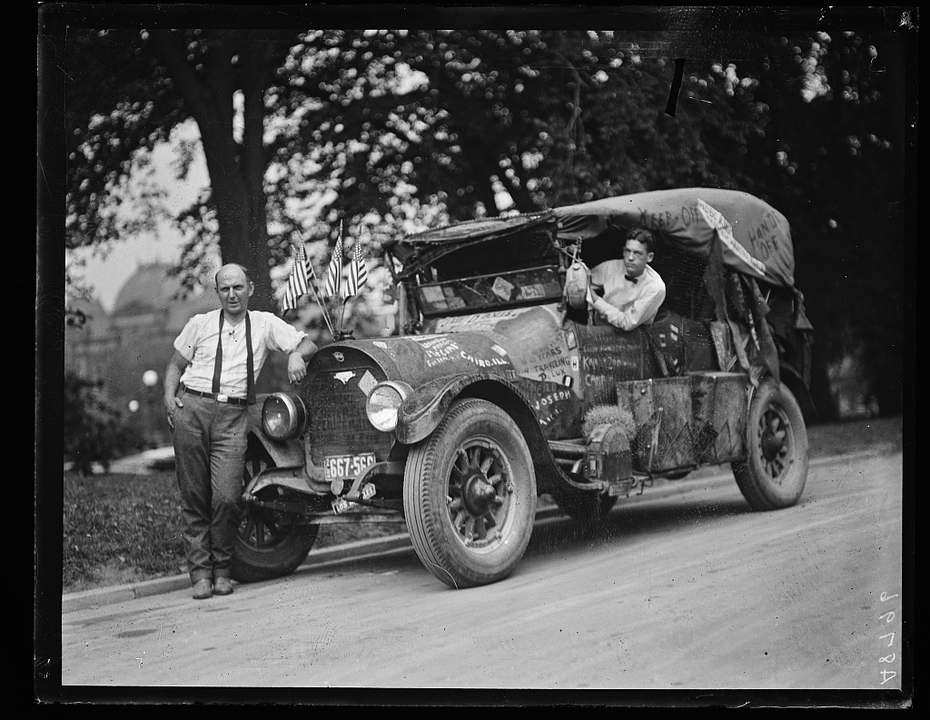 Automobile with hobo graffiti including Hobo King and Traveling DeLux