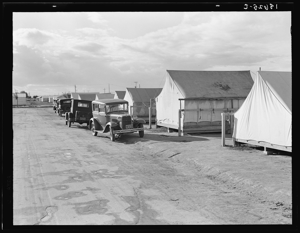 Shafter FSA camp for migrant workers, California, tent platforms along a dirt road
